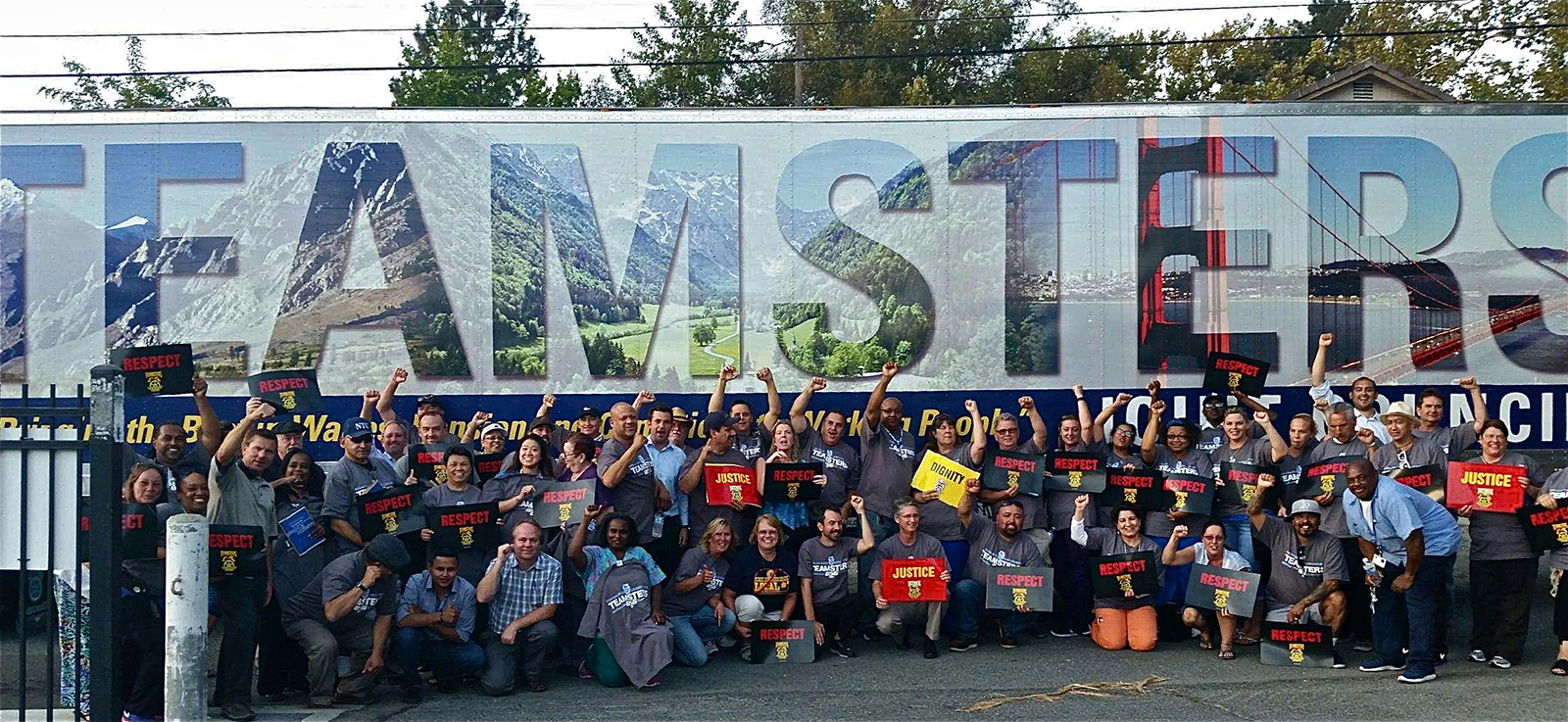 Photo of Teamsters in from of Teamster truck